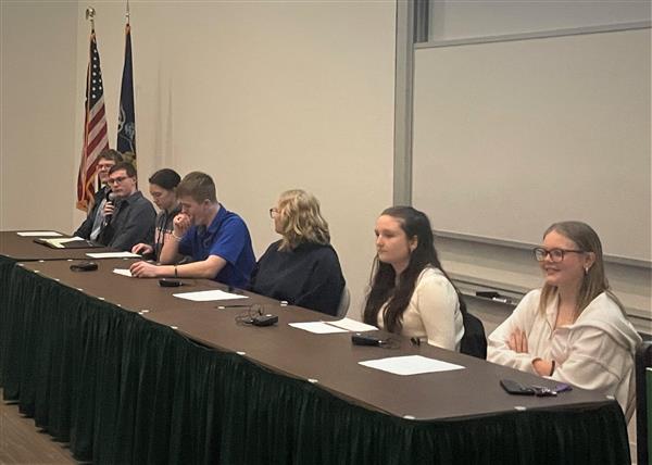  Students sitting at panel table